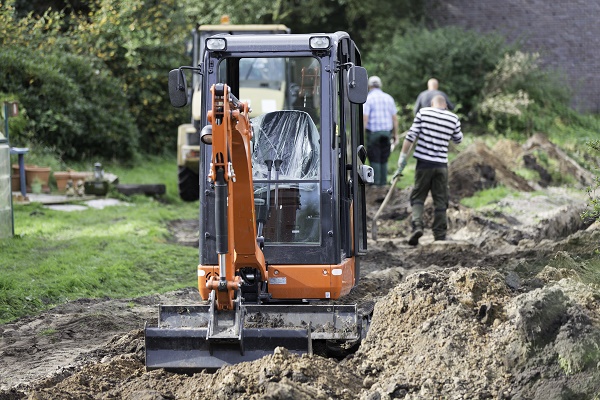 Commercial digger and workmen